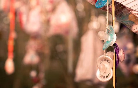Dummies and handwritten notes tied to a memorial tree
